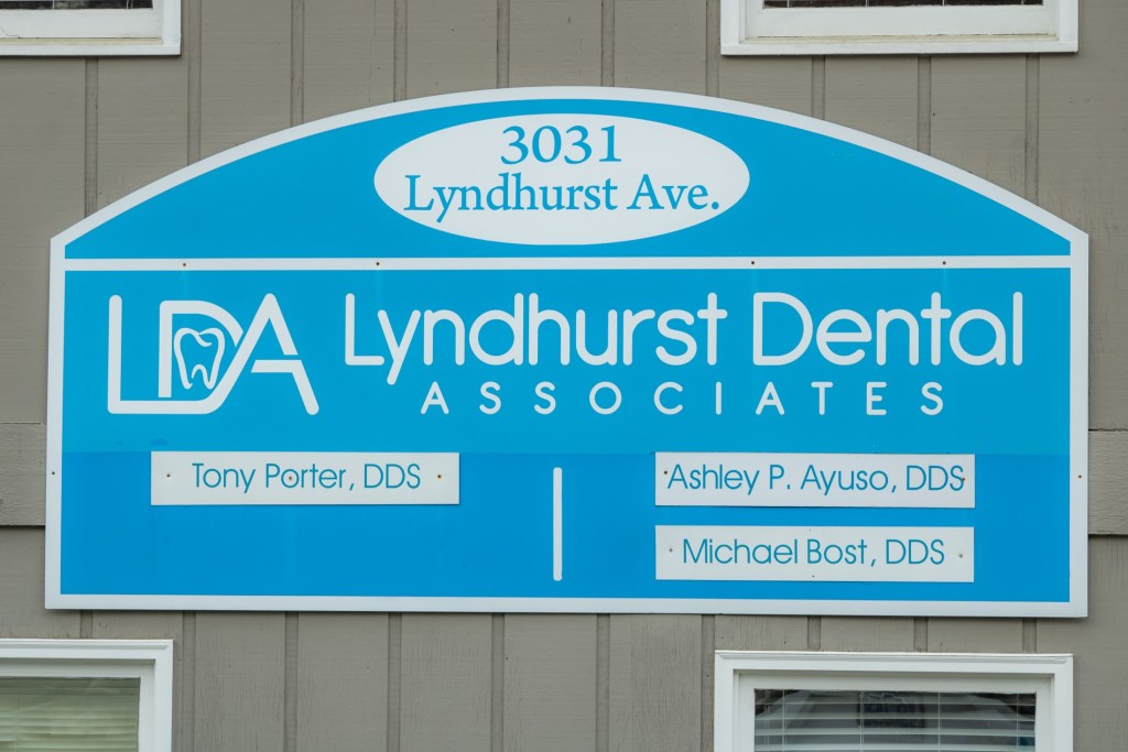 Sign displaying the dental practice name