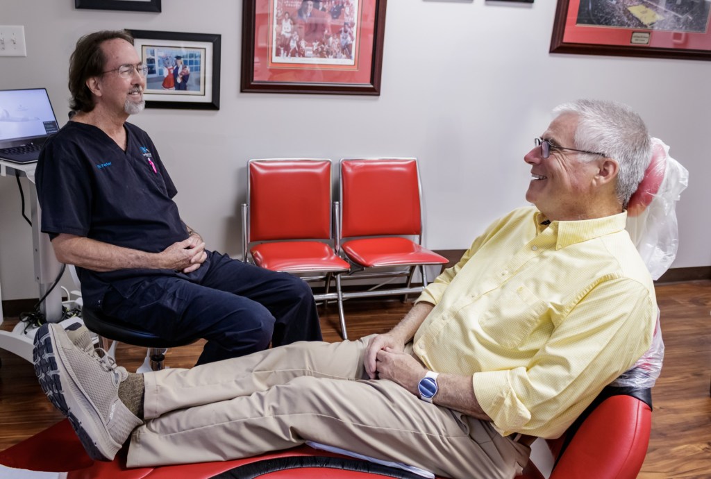 Dr. Porter smiling with a patient